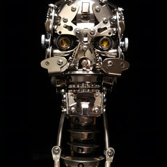 The Cybernetic Skull 'The Initiate' beginner metal puzzle, shown from the front with glowing yellow LED eyes on a black background