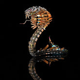 The Cyberpunk Mechanical Cobra Kit with golden accents and visible internal lighting, shown on a black reflective surface