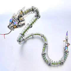 Assembled cyberpunk mechanical rattlesnake model kit, a 3D metal puzzle, with a flexible spring body and iridescent plates, on a white background.