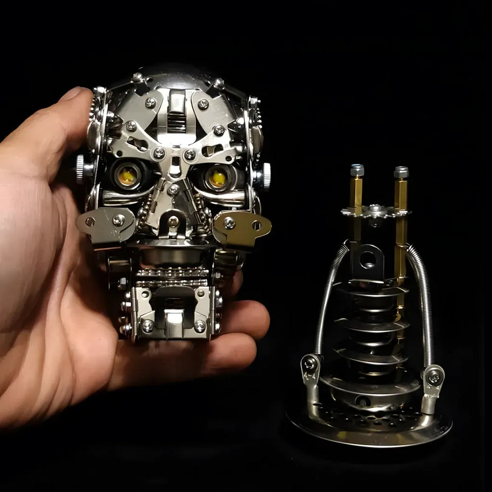 The beginner-friendly Cybernetic Skull head held in a hand next to its separate mechanical neck base on a black background.