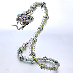 The robot snake coiled and ready to strike, showcasing the flexible spine and the detail of the metallic skin on a white background.