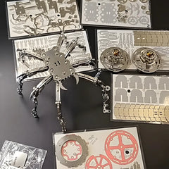 The complete DIY kit for the Cyberpunk Spider King Plus, showing the flat metal sheets of 510 parts and the partially assembled spider body. 