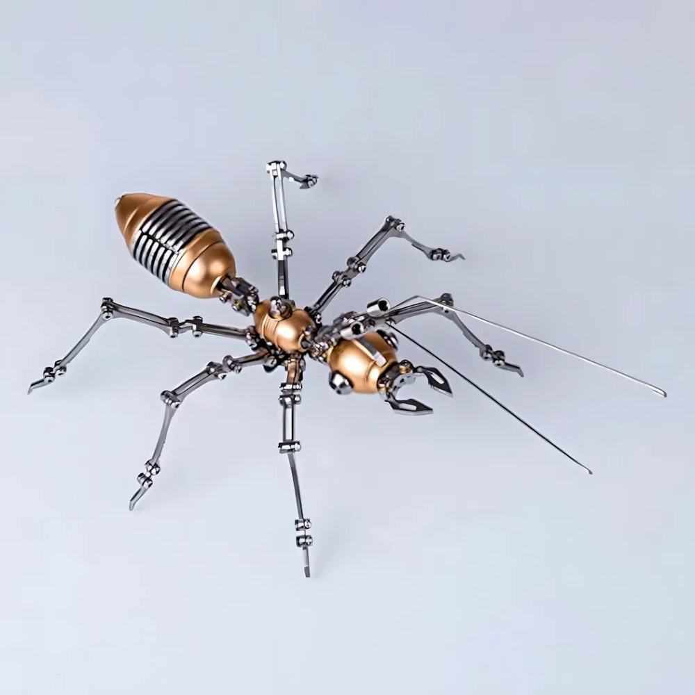The golden mechanical ant model kit side view against a clean white background, highlighting its polished copper and stainless steel components