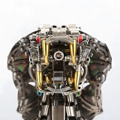 Close-up macro shot of the golden fangs and intricate jaw mechanism of the cobra head 3D puzzle against a white background