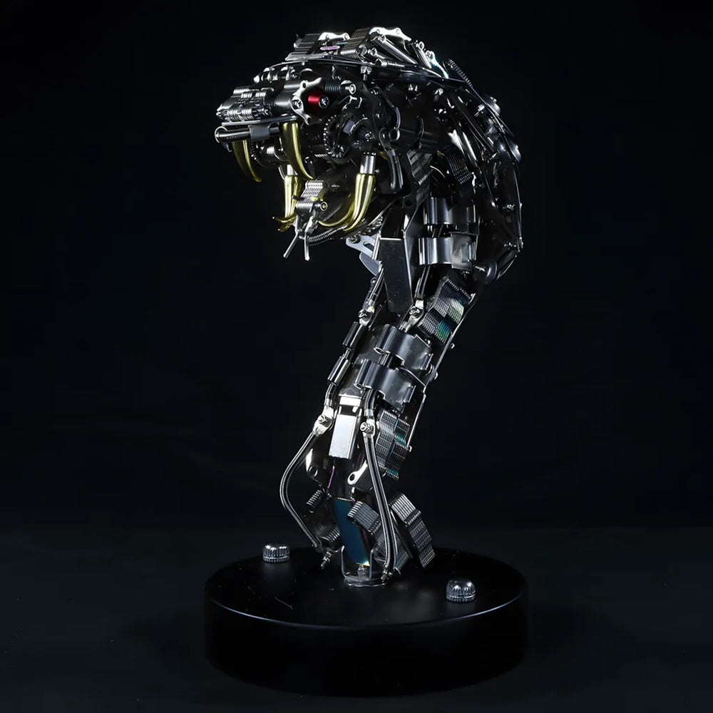 Side profile of the robot snake head bust on a black background, highlighting the articulated neck and golden fangs.
