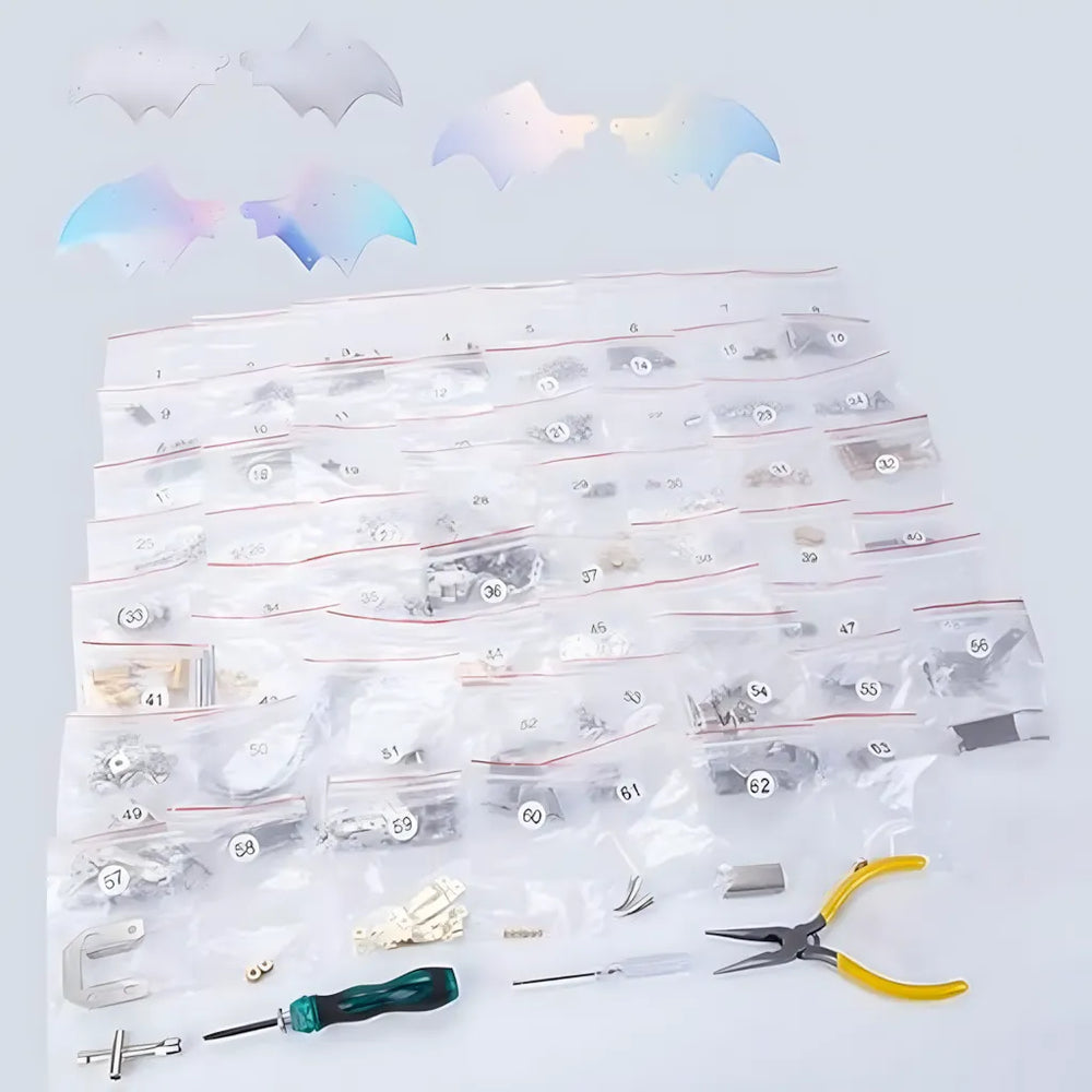 The complete 350-piece DIY kit contents, showing packaged parts, tools, and the two options of iridescent and grey wing membranes.