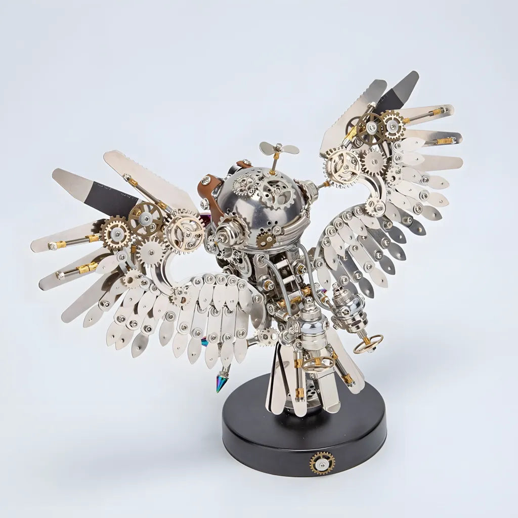 A finished Mechanical Owl metal model kit with its wings spread, shown on a white background, highlighting its metal and alloy parts