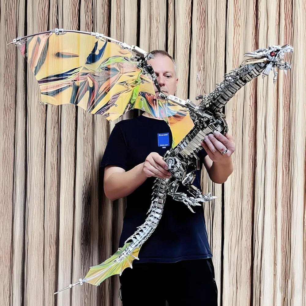 The colossal 126cm-wingspan Mechanical Wyvern held by a builder, showing the impressive scale of the 3000+ piece model