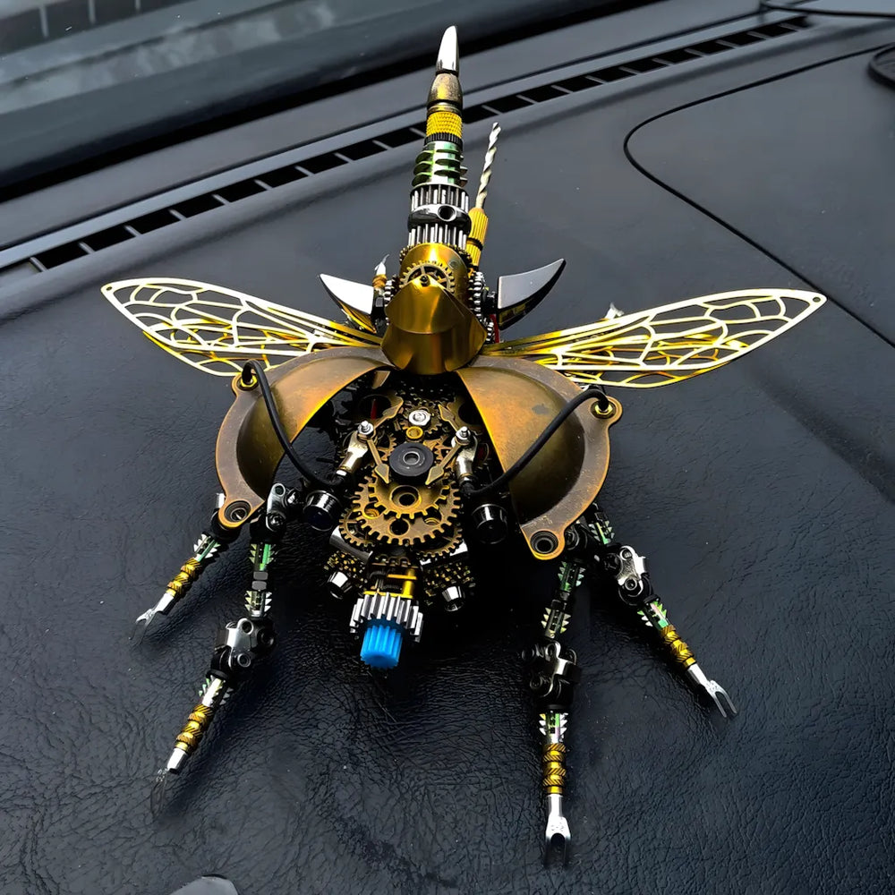 The mechanical beetle puzzle placed on a dark dashboard, highlighting the brass shell and exposed open-heart gear system