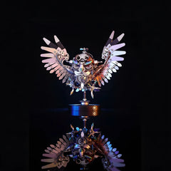 The Steampunk Mechanical Owl model with wings spread, showcased on a black reflective surface with iridescent light effects
