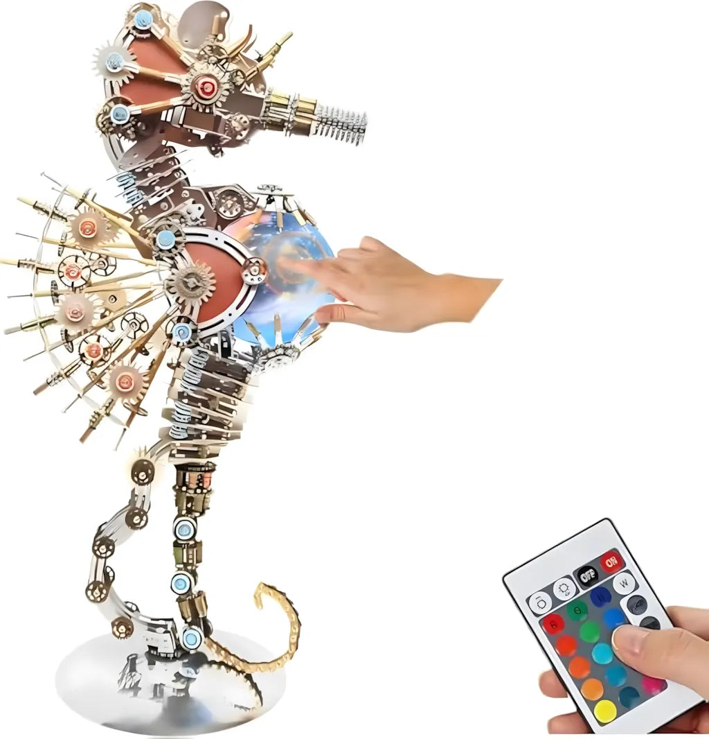 The 2100+ piece Mechanical Seahorse DIY kit shown with a hand touching the orb and the smart 24-key RGB remote control  for lighting effects.
